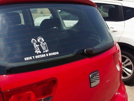 Stick figure family on rear car window